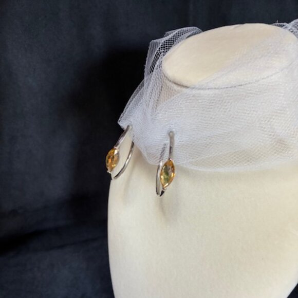 Silver tone hoop earrings with yellow rhinestones. - Picture 4 of 4